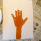 Paint the child's hand and arm brown and press on paper to make tree trunk.