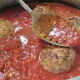 Add the browned meatballs into the sauce