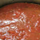 Meatballs all covered with sauce and ready to cook