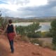 Hiking the trail in the park with a view of Wide Hollow Reservoir below