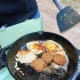 Fried eggs and sausage make for a great outdoor breakfast.