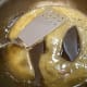 Pour mixture in pan and stir until it boils and becomes thick.