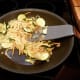 Chop vegetables like zucchini, onions and carrots and stir-fry in a pan with a teaspoon of oil for about 5 minutes, or until slightly soft. Add already cooked pasta or noodles. Stir until hot through. Add cooked chicken or beef and 1/4 cup sauce.