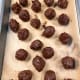 Divide them into equal-sized balls. Transfer the chocolate balls to the tray and let them sit in the fridge before assembling.