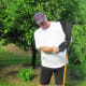 My dad, a Frugal Engineer, displays his apple picker made out of a leg of jogging pants that had a hole in them. And he is wearing the pants as cut-offs.