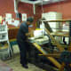 Here, Charles is pulling a lithography print off of a starwheel press from 1830.