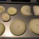 Slice an onion into thin slices and put them on a baking sheet. (I used a cookie sheet but something with higher sides is preferable since you'll be pouring liquid in the pan.)