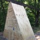 I used another sheet of plywood cut to make a triangle-shaped wall. Two doors were cut into the wall. The top door was on top of the climbing tower making a great storage area. The bottom door was to the duck house where they would sleep.