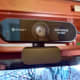 Webcam sitting on top of a monitor