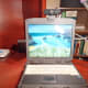 eMeet Nova perching atop a laptop