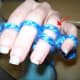 See the "old" strand behind your finger? This is the one that is pulled over the "new" strand and off of your finger.