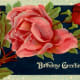 vintage birthday card: red and pink roses on a black background "Birthday Greetings"