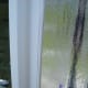 BACK CAULKING THE TAPE TO THE NEW WINDOW