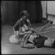 Zuni woman with a large lap loom