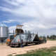 Livestock trucks regularly use a scale located close to the work sites, so grain bin components must be able to be unloaded out of the way.