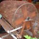 A homemade compost tumbler. You can quickly and easily build one of these yourself and use it for a long time before you have to build another one.