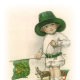 Little vintage boy in green top hat with Irish flag