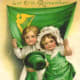 St. Patrick's Day vintage greeting cards: Two cute kids holding green top hat in front of Irish flag "Let Erin Remember"