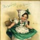 Vintage children: Little girl dancing on a chair "The wearing of the green"