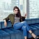 Hailee Steinfeld crossed legs in skinny jeans and stylish stilettos