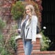 Carmen Electra posing for the camera in her curve hugging jeans