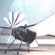 flying-machine with retractable wheeled landing gear, a tractor propeller, an internal engine and a boat-shaped hull