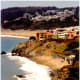 Looking back at some colorful buildings perched on a cliff overlooking the Bay
