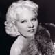 Mae West wearing curly medium length bob hair style
