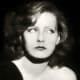 Greta Garbo, 1927, wearing curly medium length bob hair style