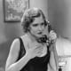 Mae Clarke wearing wavy short bob hair style