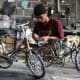 Craftsman makes famous antique bicycle miniature in his simple workshop in villages around Yogyakarta City, Central Java Province, Indonesia