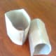 To get the contours without kinking, wet cardboard using spray bottle until it gives just enough to roll to desired shape.