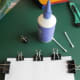 Use paper clips to hold the pages together to make the spine.