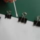 Apply glue on the spine with a cotton bud.