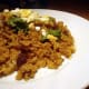 This is dry curry, where you flavor the rice with curry powder so it looks like a fried rice, tastes like curry.