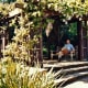 My hubby resting under an arbor.