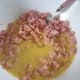 Mix egg and milk mixture with ham