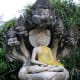 This Buddha image in one of the many gardens in the park is being protected by the Naga, a giant snake in Buddhist mythology, often depicted with multiple heads