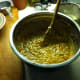 Graded carrots along with walnut and pineapple have been added and mixed to the batter.