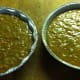 Batter has been poured into the cake pans and is now ready to place into the oven.