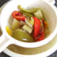 Stock is strained through a colander