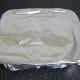 Tinfoil covers the chicken and vegetables while they rest