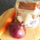 New potatoes, red onion and carrot are roasted with the chicken legs