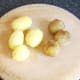Peeling cooked and cooled potatoes for roasting