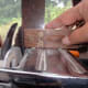 Using Square to ensure blade to electric circular saw is square.