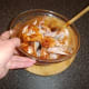 Carefully folding the chicken wings through the spice paste