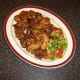 Salad garnish is plated alongside the Lebanese spice chicken wings