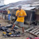 The electrically-charged drills which form the most vital machines to construct the house are put on a regular charging schedule. The old house is seen in the background.