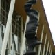 Closeup photo of the skinnier sculpture. See the faces?