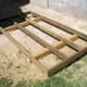 Floor joists and bands attached to 4x4 skids, all pressure treated lumber